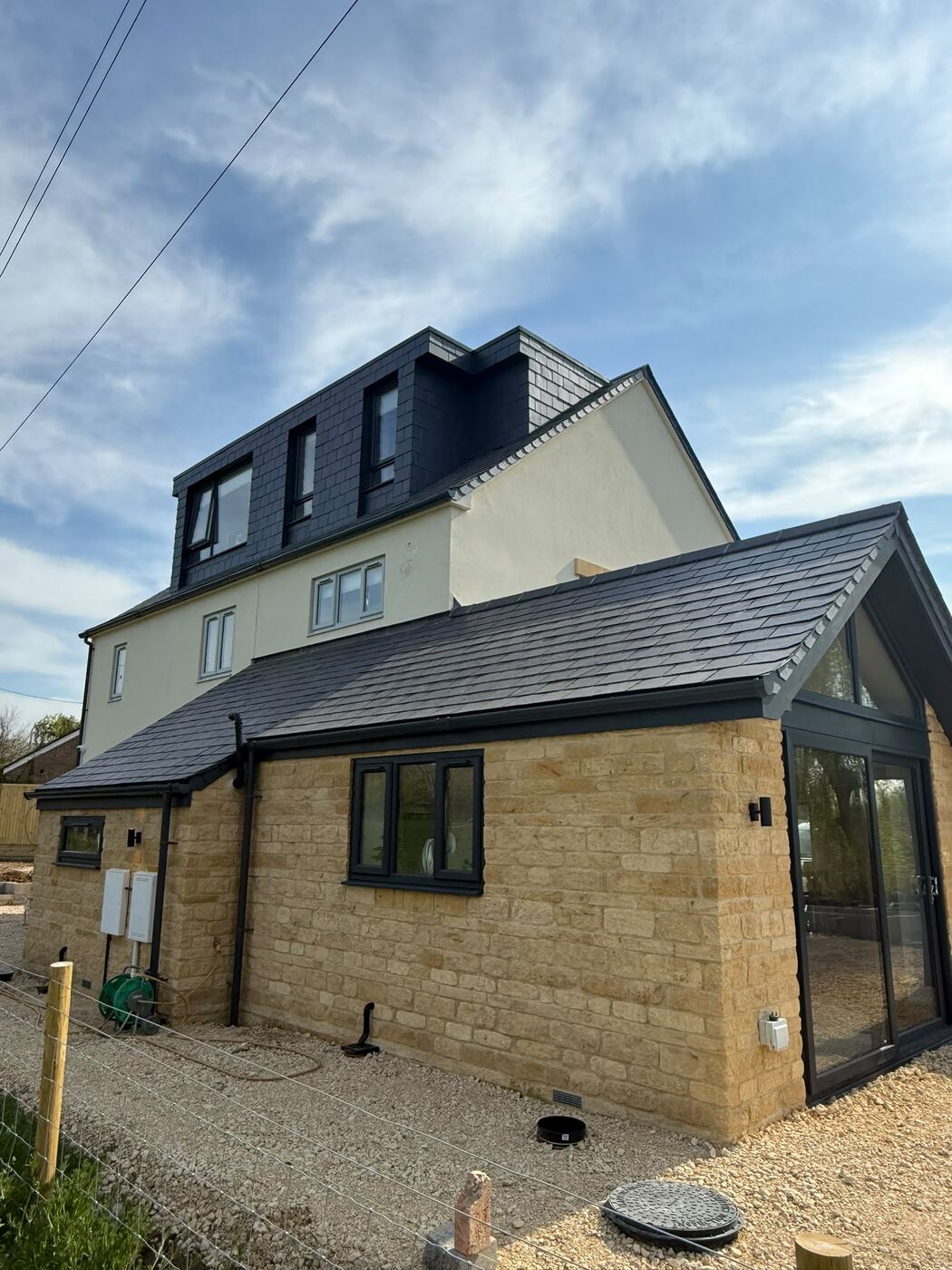 Stone house with new slate roof and slate-clad dormer, Broadway