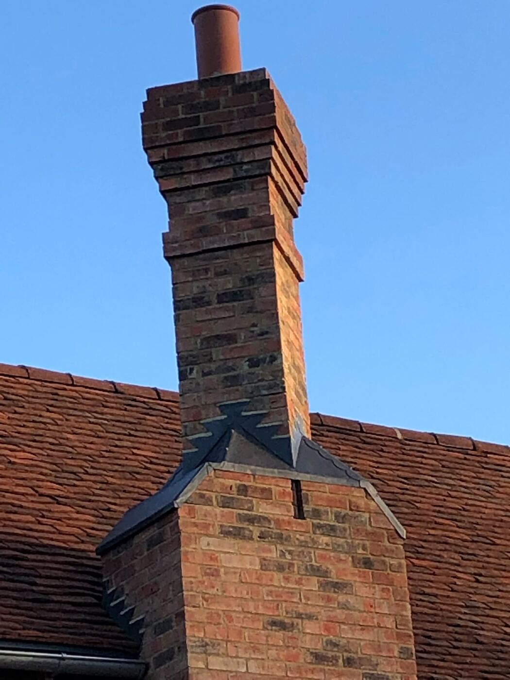 Restored brick chimney at dusk
