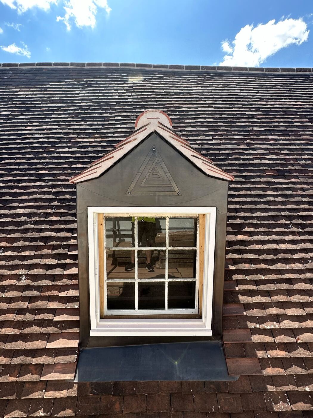 Dormer with sash window in plain tiles
