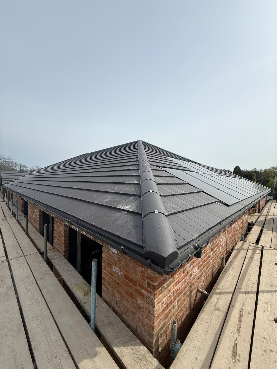 Hipped roofs in concrete interlocking tiles, Little Aston